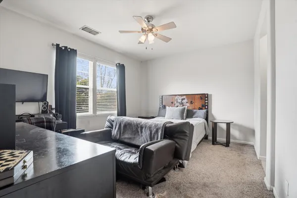 a bathroom with a toilet sink and shower