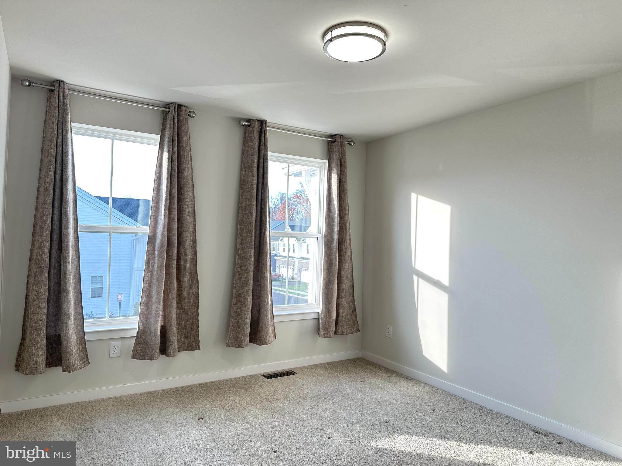 303 Wynstone Court Colmar, PA 18915 - Photo 18 of 26 an empty room with windows