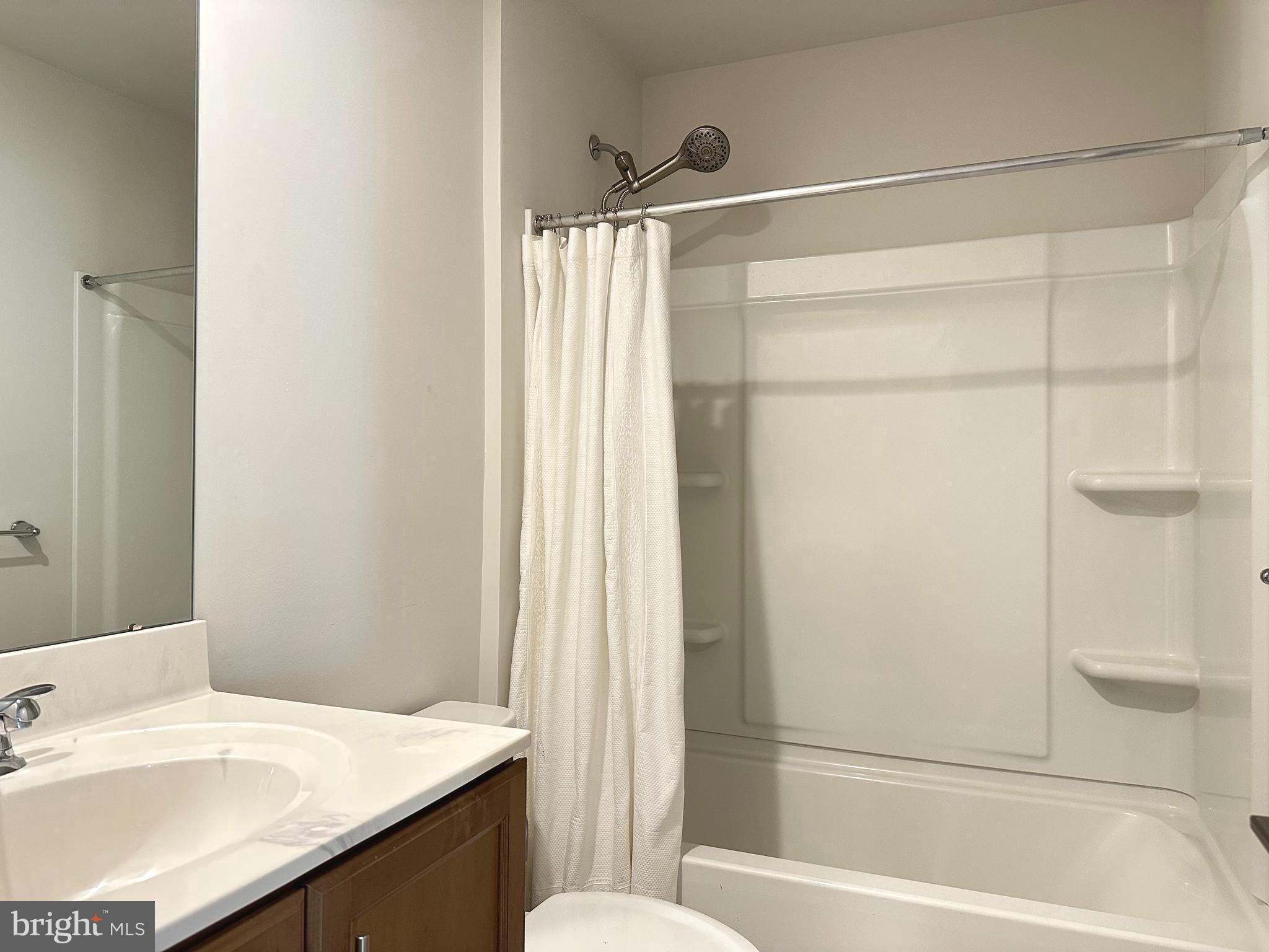 303 Wynstone Court Colmar, PA 18915 - Photo 19 of 26 a bathroom with a granite countertop sink toilet and shower