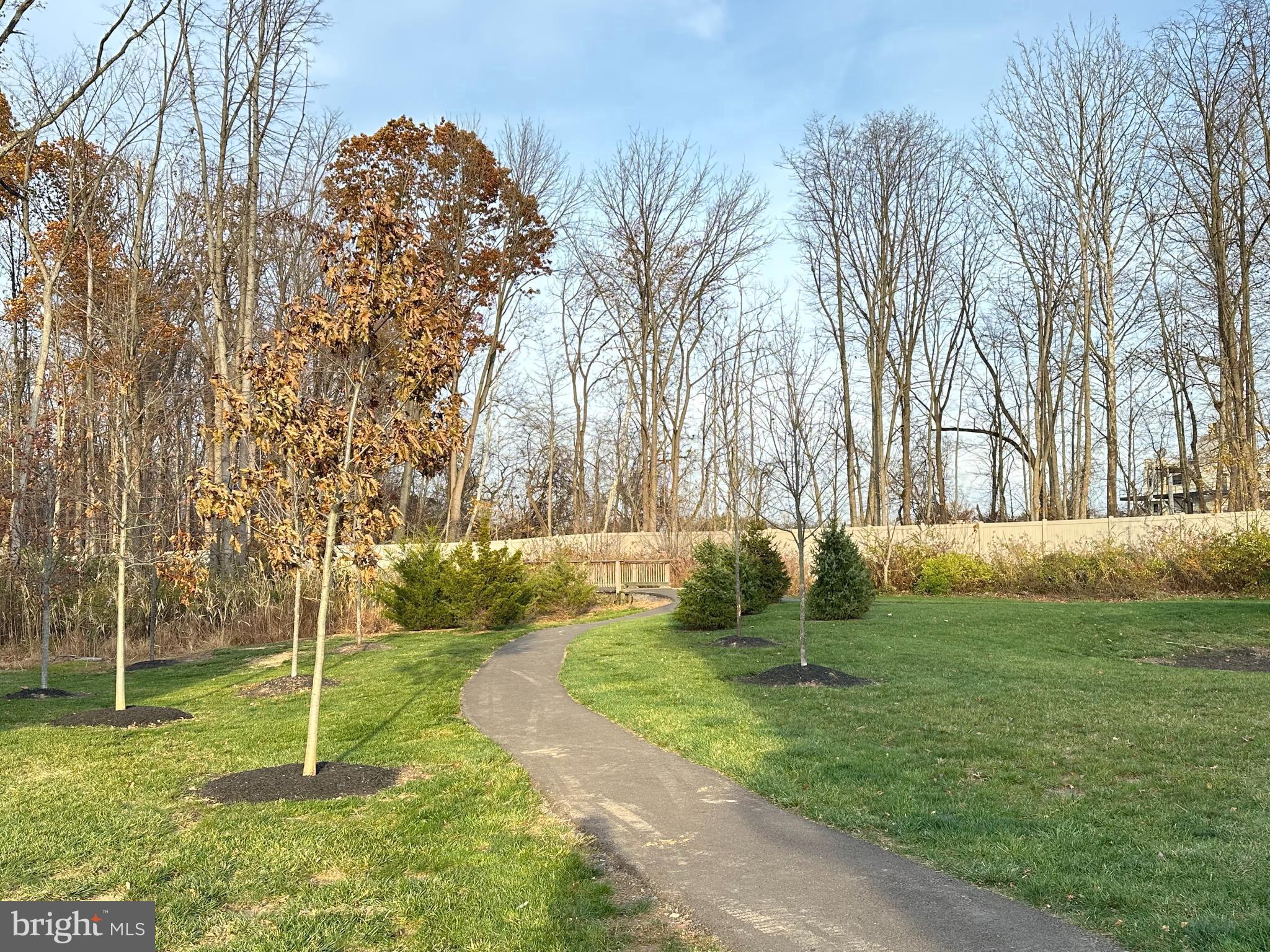 303 Wynstone Court Colmar, PA 18915 - Photo 25 of 26 a backyard of a house with lots of green space