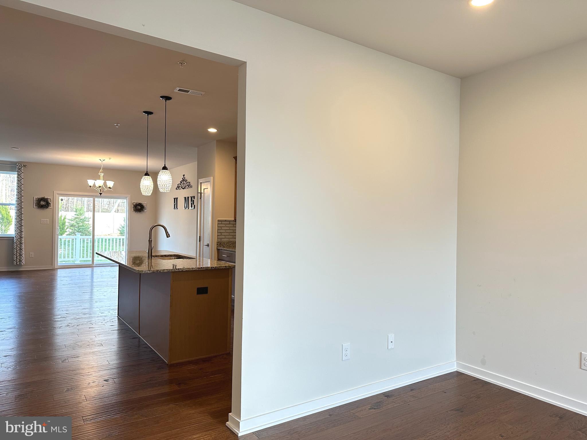 303 Wynstone Court Colmar, PA 18915 - Photo 3 of 26 a view of a hallway with wooden floor