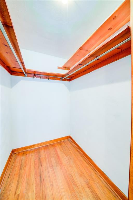 3927 Edge Road Pittsburgh, PA 15227 - Photo 15 of 25 Master bedroom large walk in closet -- these are the beautiful hardwood floors found under all carpet