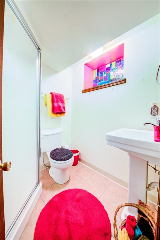 3927 Edge Road Pittsburgh, PA 15227 - Photo 22 of 25 2nd full bath located in the lower level-has ceramic tile floor, stand up shower and pedestal sink