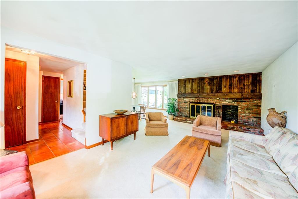 Entry w/center hallway is ceramic tile-- hardwood under all carpet.