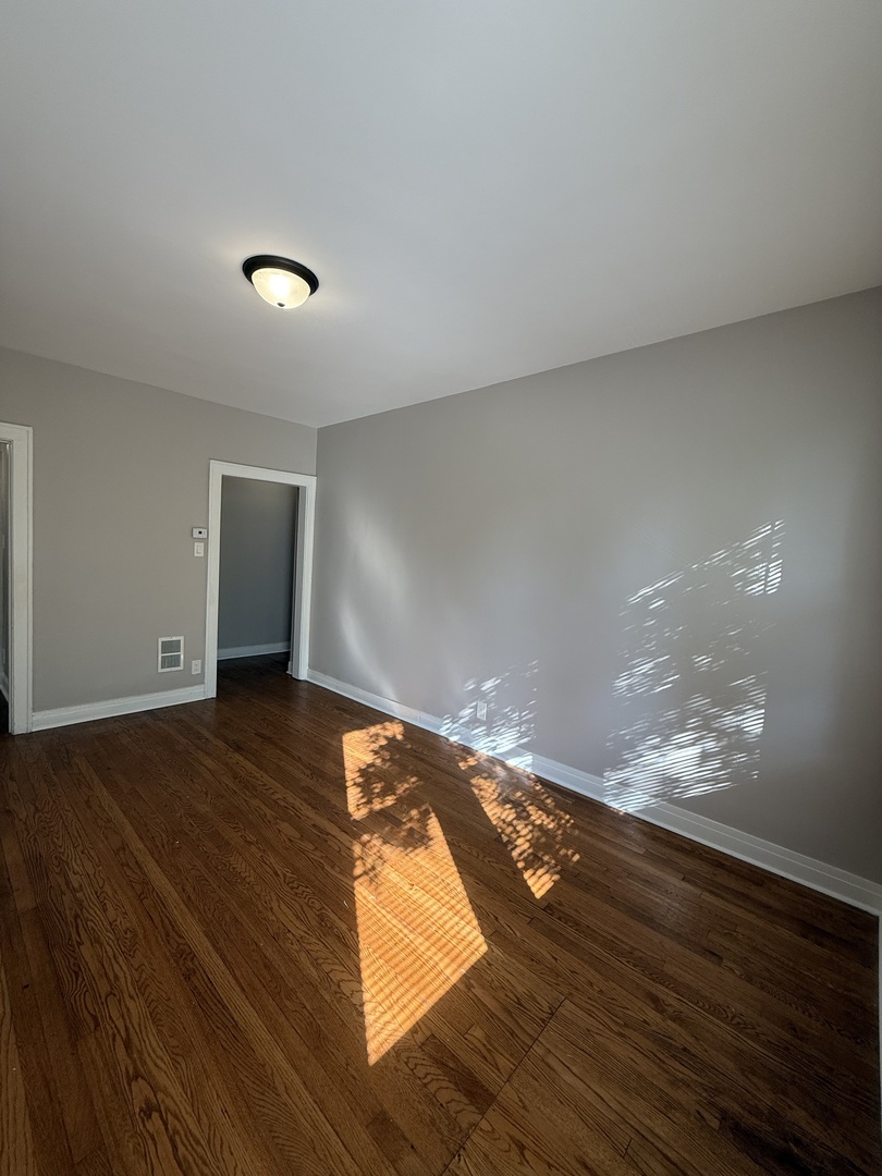 3901 West Division Street, Unit 1150 Chicago, IL 60651 - Photo 2 of 9 a view of empty room with wooden floor