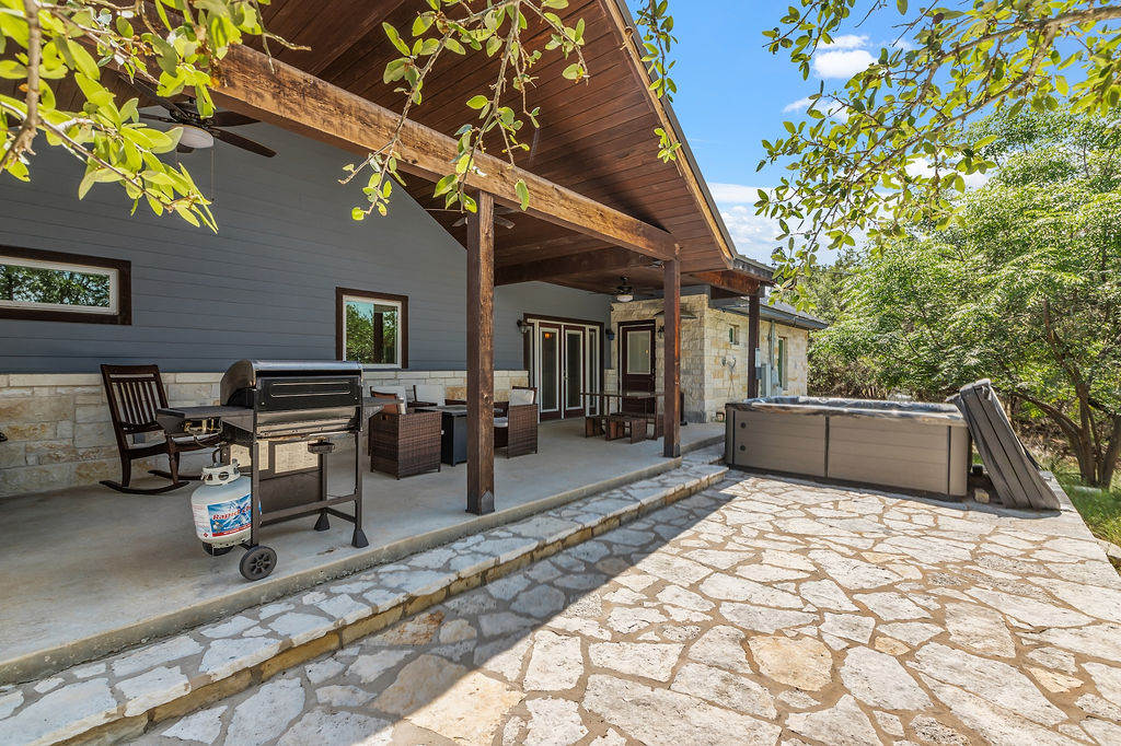 13326 Trautwein Road Austin, TX 78737 - Photo 27 of 38 View of patio with a hot tub, ceiling fan, outdoor lounge area, and outdoor dining area