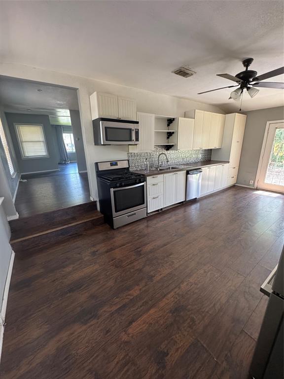 629 Harrison Lane Hurst, TX 76053 - Photo 14 of 20 a view of kitchen with sink microwave and cabinets