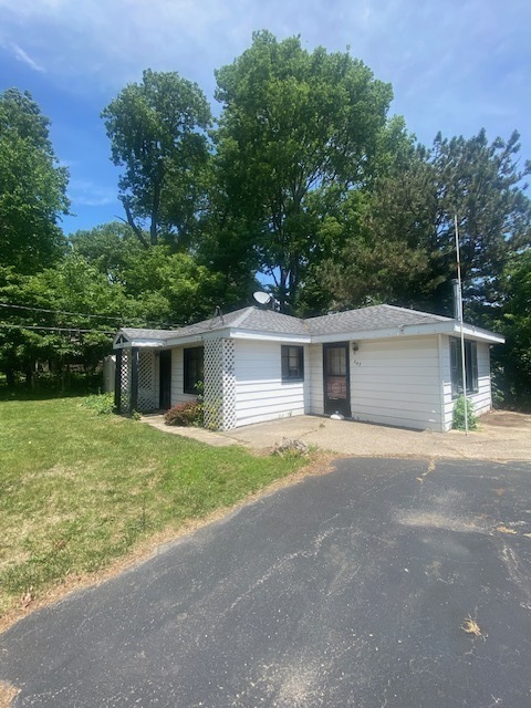 143 Eagle Point Road Fox Lake, IL 60020 - Photo 17 of 19 front view of a house with a yard and trees