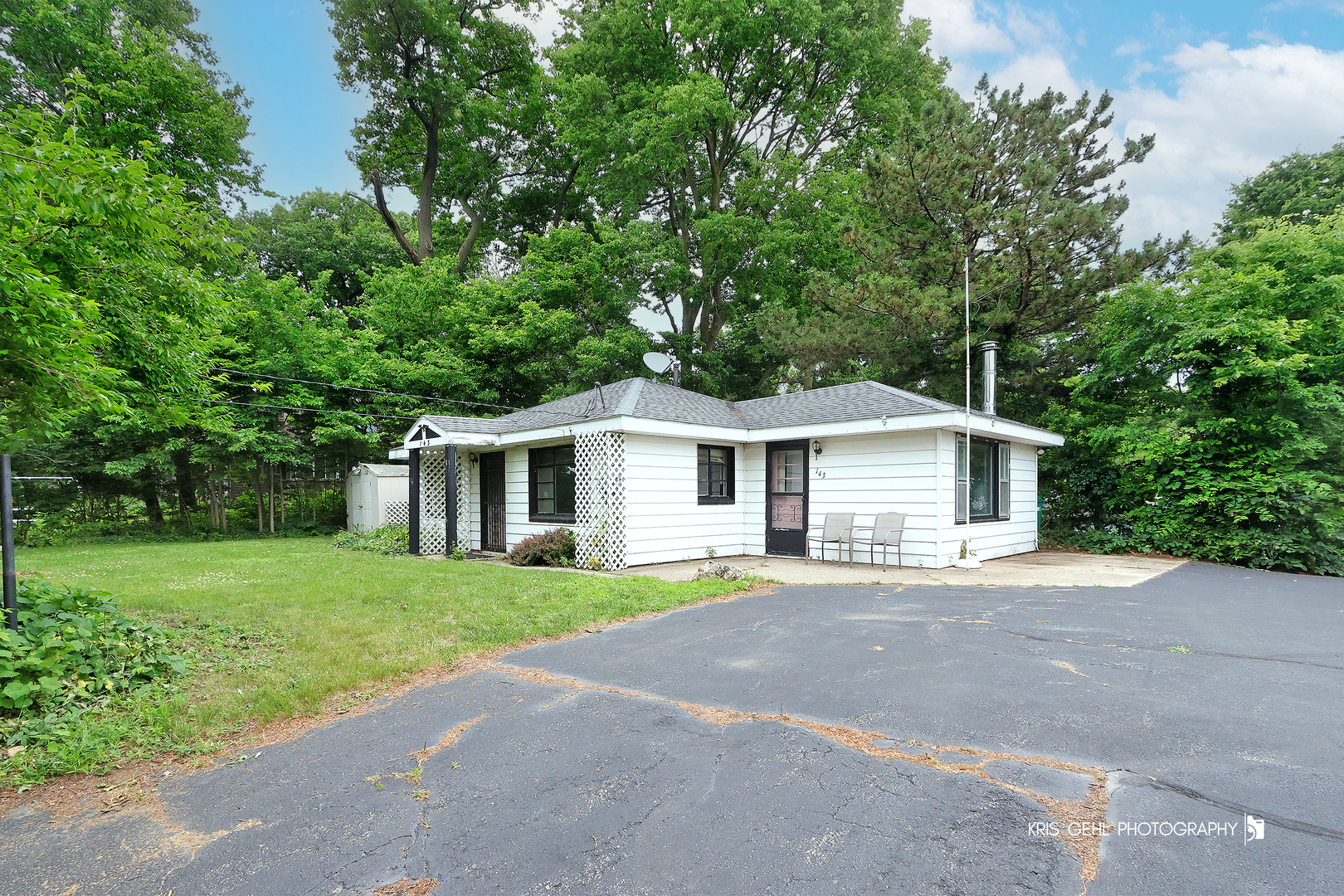 143 Eagle Point Road Fox Lake, IL 60020 - Photo 2 of 19 a front view of a house with a garden
