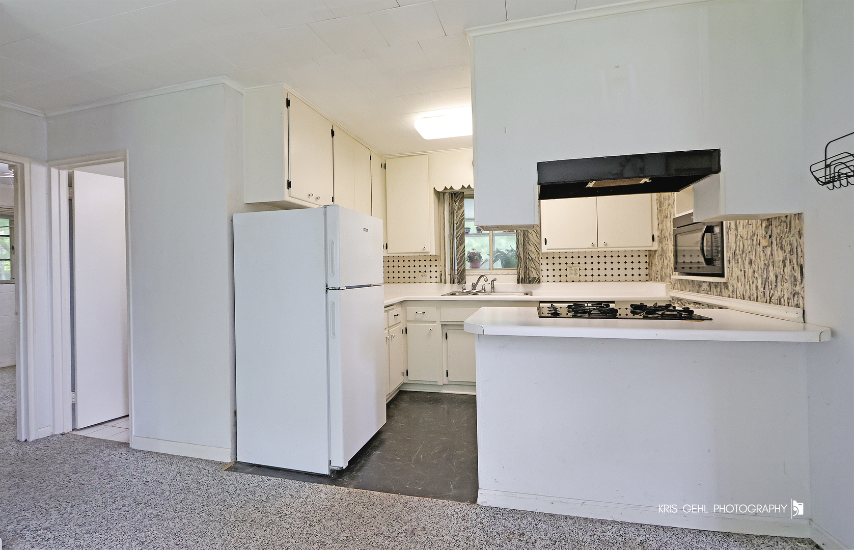 143 Eagle Point Road Fox Lake, IL 60020 - Photo 7 of 19 a kitchen with white cabinets and refrigerator