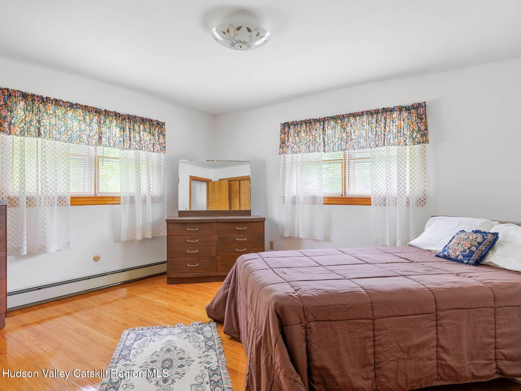 104 New Paltz Road Highland, NY 12528 - Photo 18 of 43 a bedroom with a bed and window