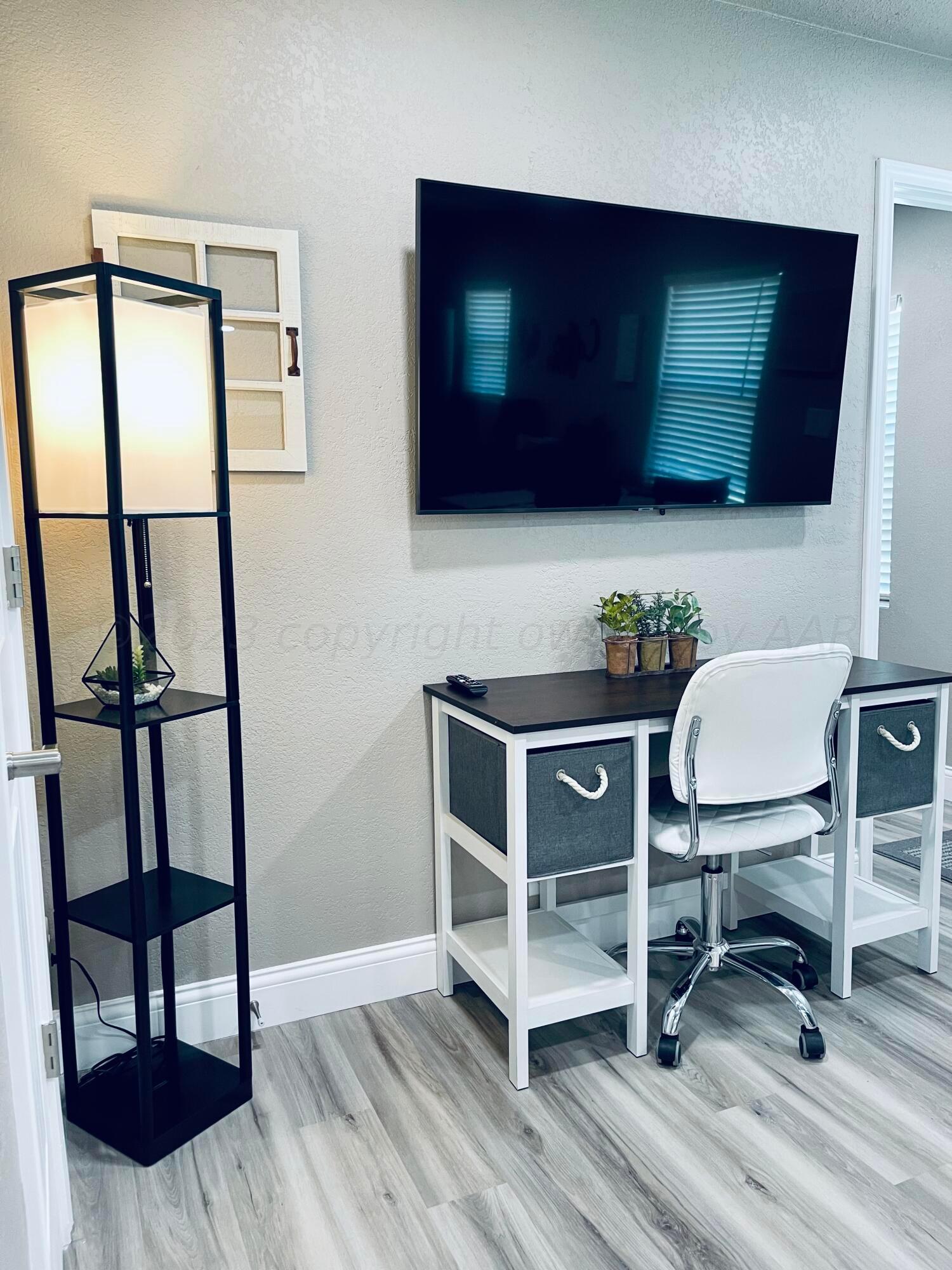 3501 Moss Lane Amarillo, TX 79109 - Photo 18 of 51 a living room with furniture and a flat screen tv