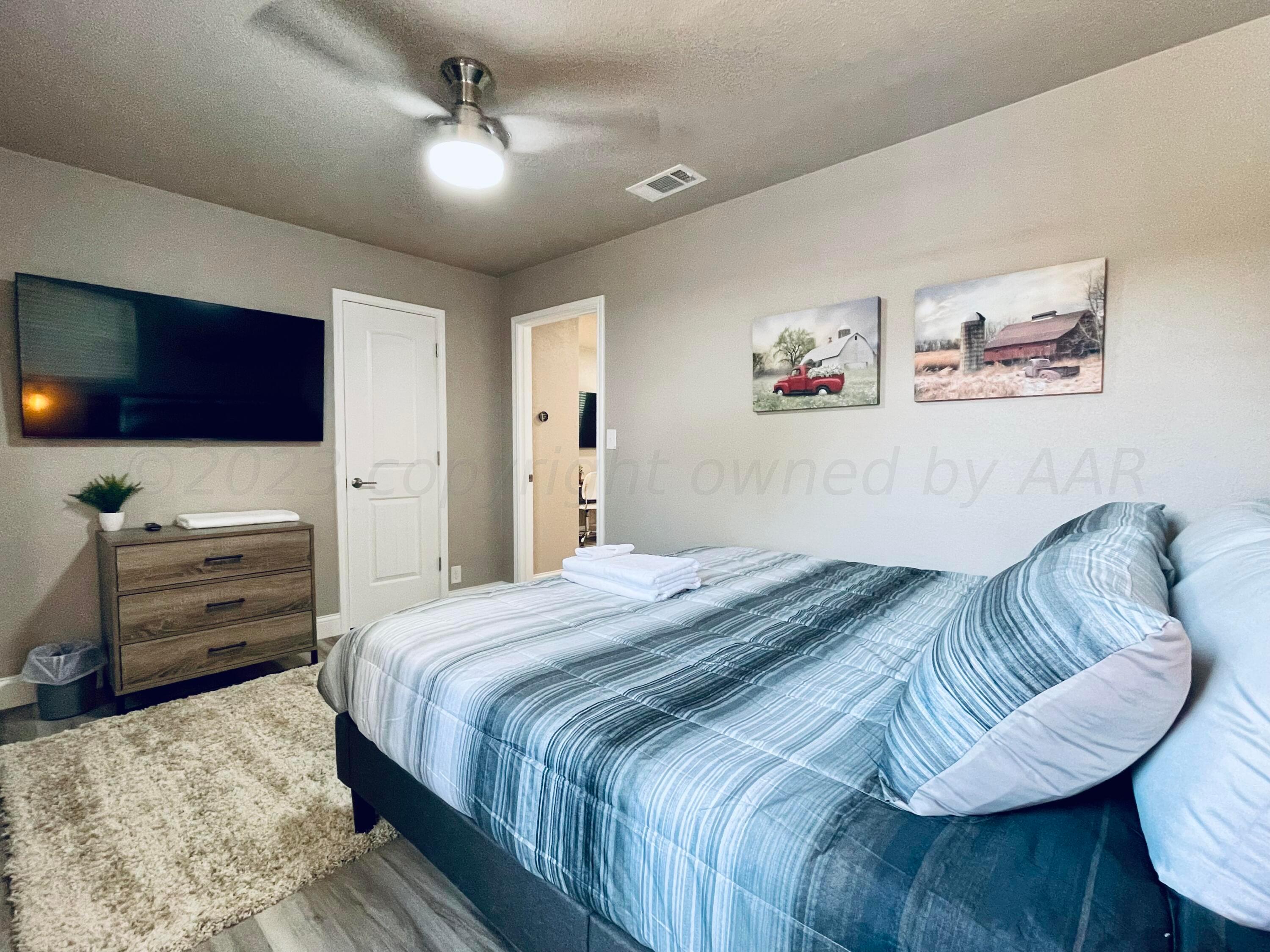 3501 Moss Lane Amarillo, TX 79109 - Photo 23 of 51 a bedroom with a bed and a television