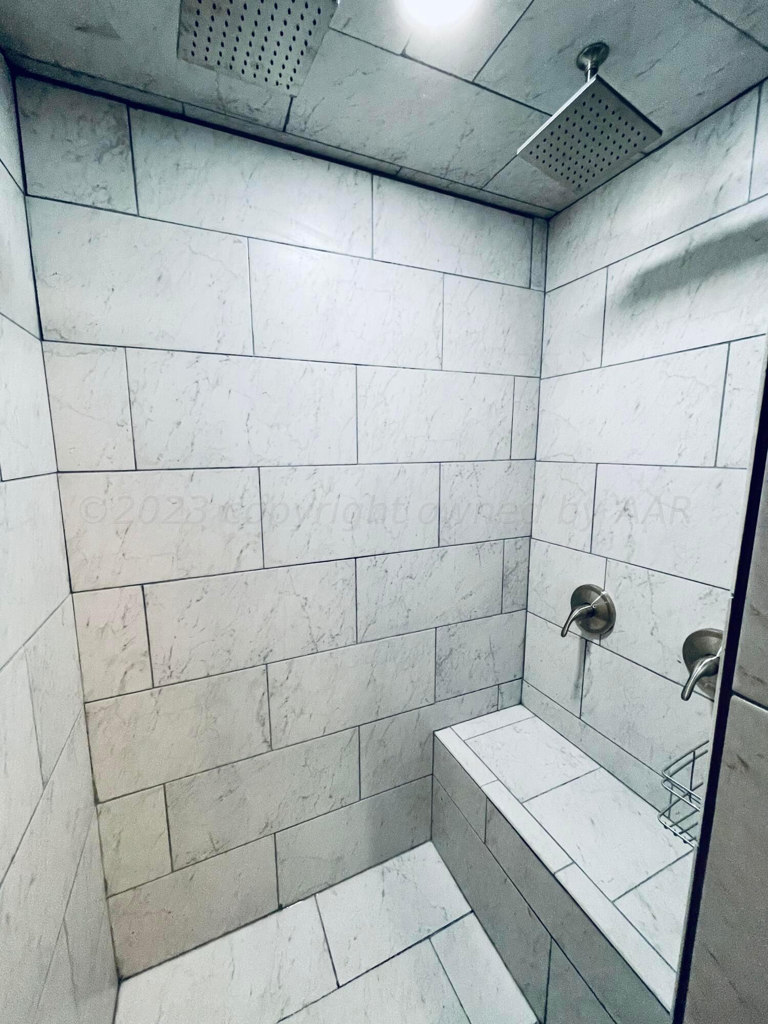 3501 Moss Lane Amarillo, TX 79109 - Photo 27 of 51 a bathroom with a sink and shower