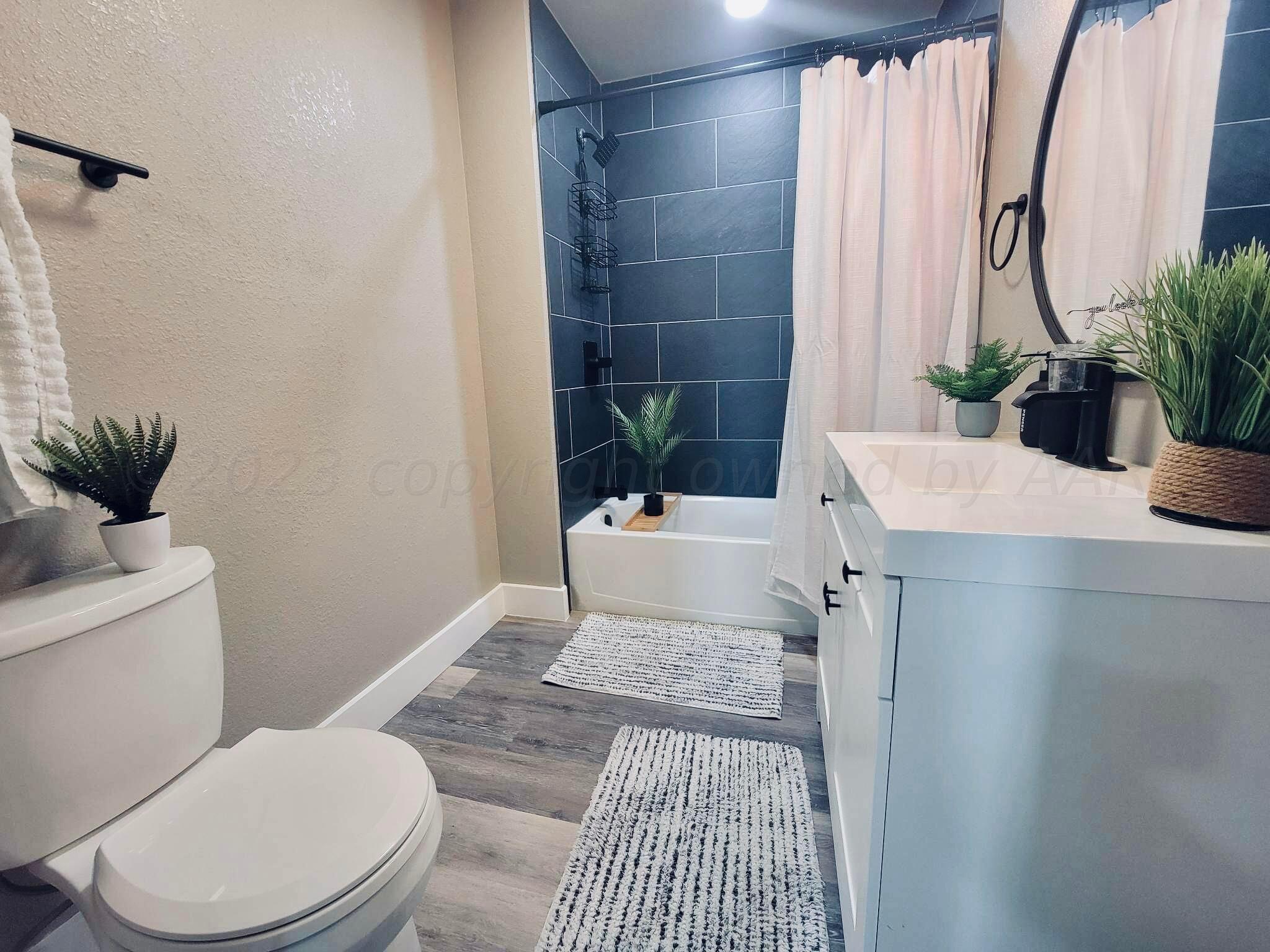 3501 Moss Lane Amarillo, TX 79109 - Photo 34 of 51 a bathroom with a sink toilet and shower