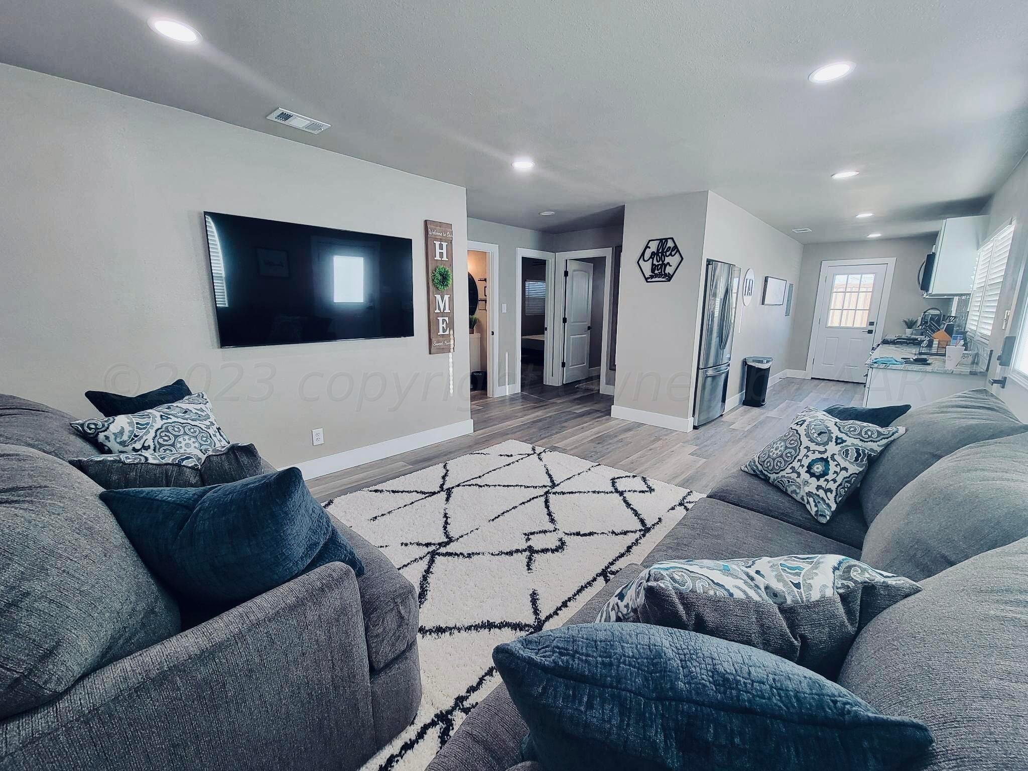 3501 Moss Lane Amarillo, TX 79109 - Photo 39 of 51 a living room with furniture and a flat screen tv