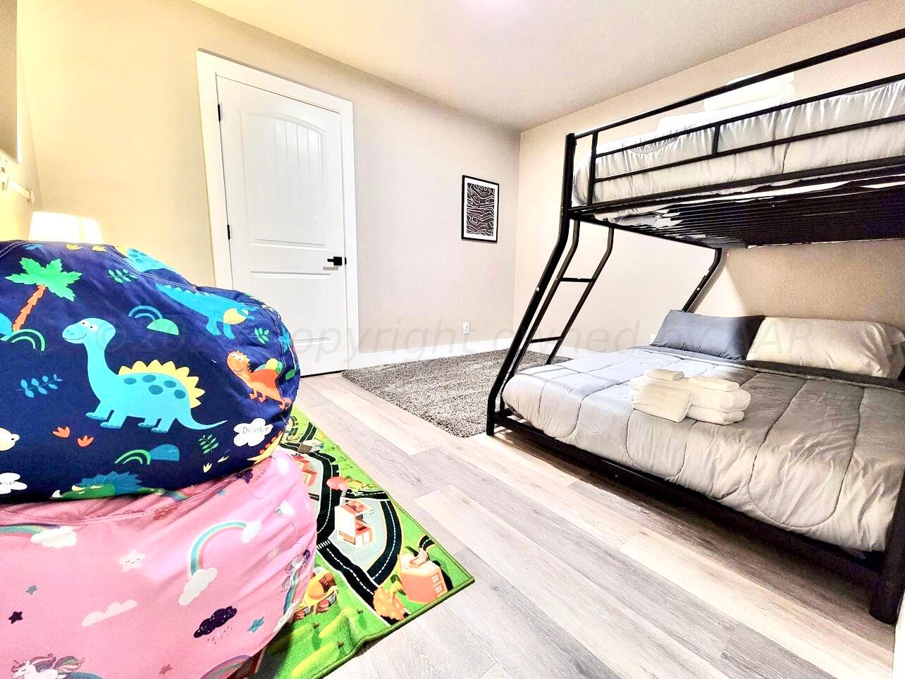 3501 Moss Lane Amarillo, TX 79109 - Photo 42 of 51 a bedroom with a bed and a painting on the wall