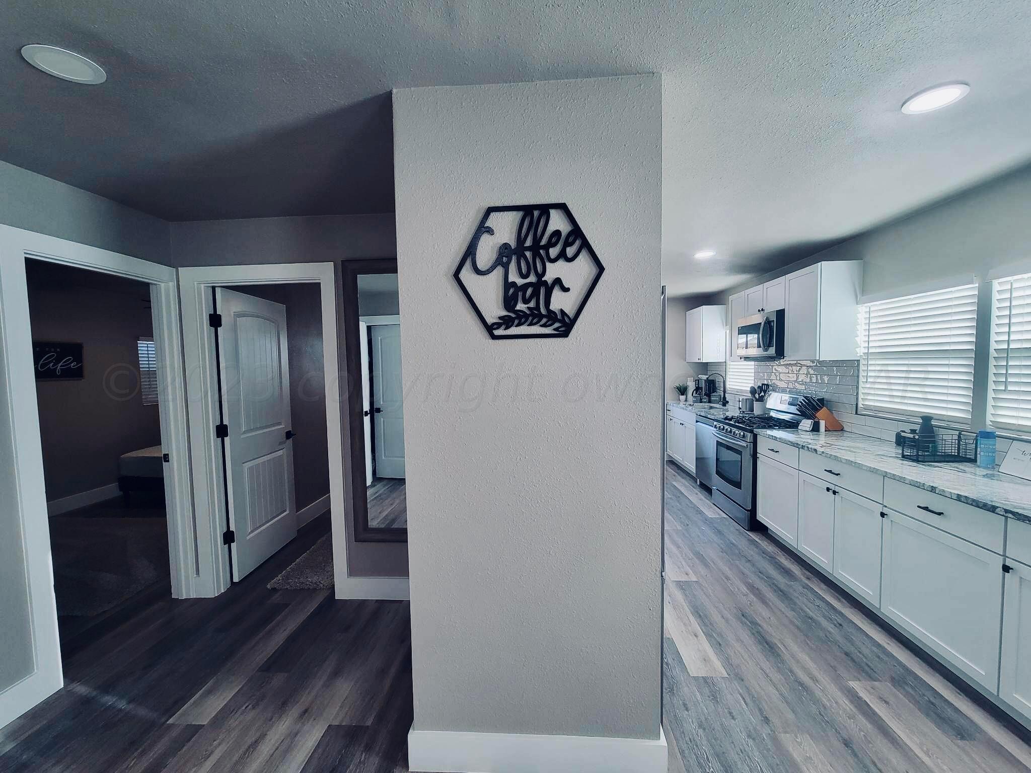 3501 Moss Lane Amarillo, TX 79109 - Photo 5 of 51 a kitchen with a refrigerator and a stove top oven
