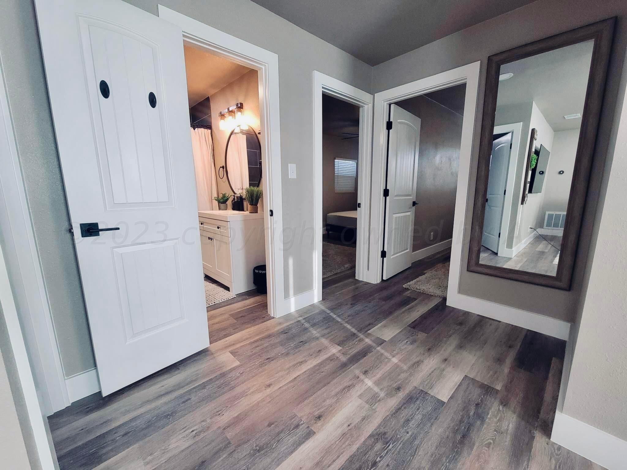 3501 Moss Lane Amarillo, TX 79109 - Photo 6 of 51 a view of a hallway view with wooden floor and staircase