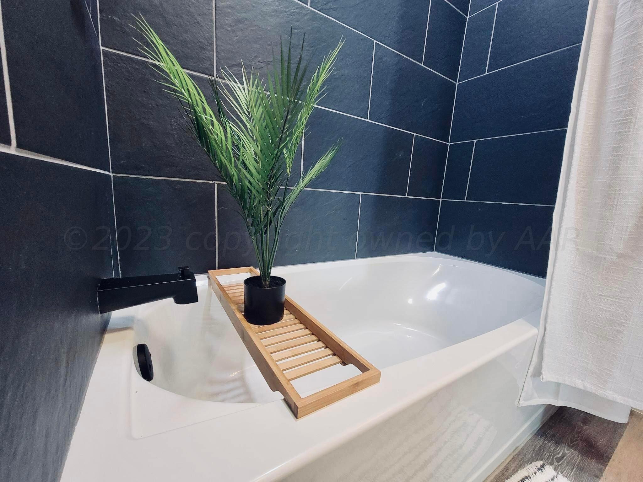 3501 Moss Lane Amarillo, TX 79109 - Photo 7 of 51 a bathroom with a bathtub