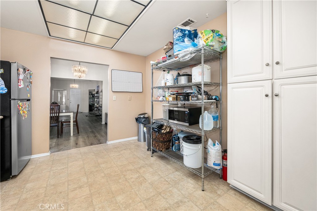 9722 Walnut Street Bellflower, CA 90706 - Photo 18 of 55 a kitchen with a sink stainless steel appliances furniture and a window