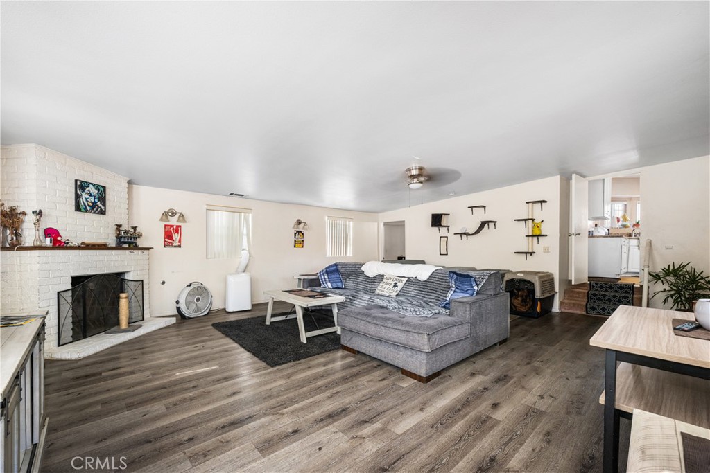 9722 Walnut Street Bellflower, CA 90706 - Photo 21 of 55 a living room with furniture and a fireplace