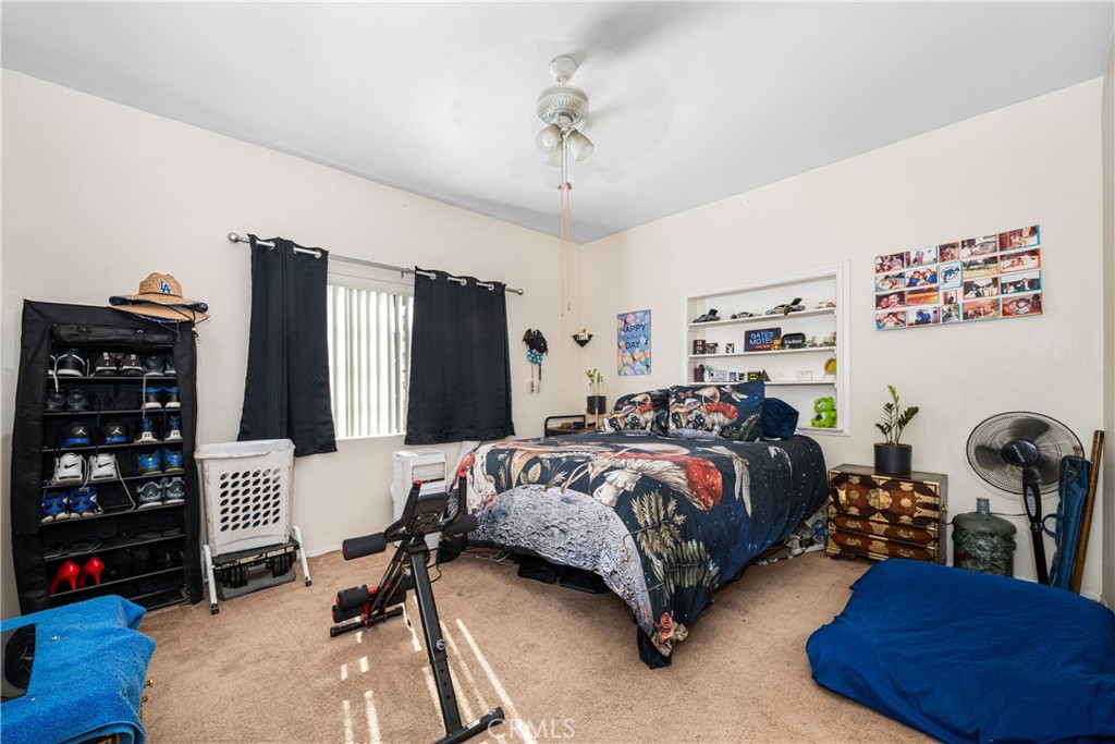 9722 Walnut Street Bellflower, CA 90706 - Photo 26 of 55 a bedroom with bed and a large mirror