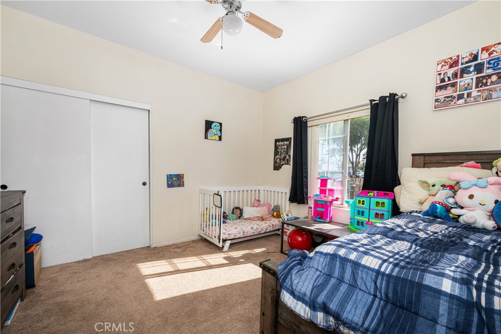 9722 Walnut Street Bellflower, CA 90706 - Photo 33 of 55 a bedroom with bed and windows