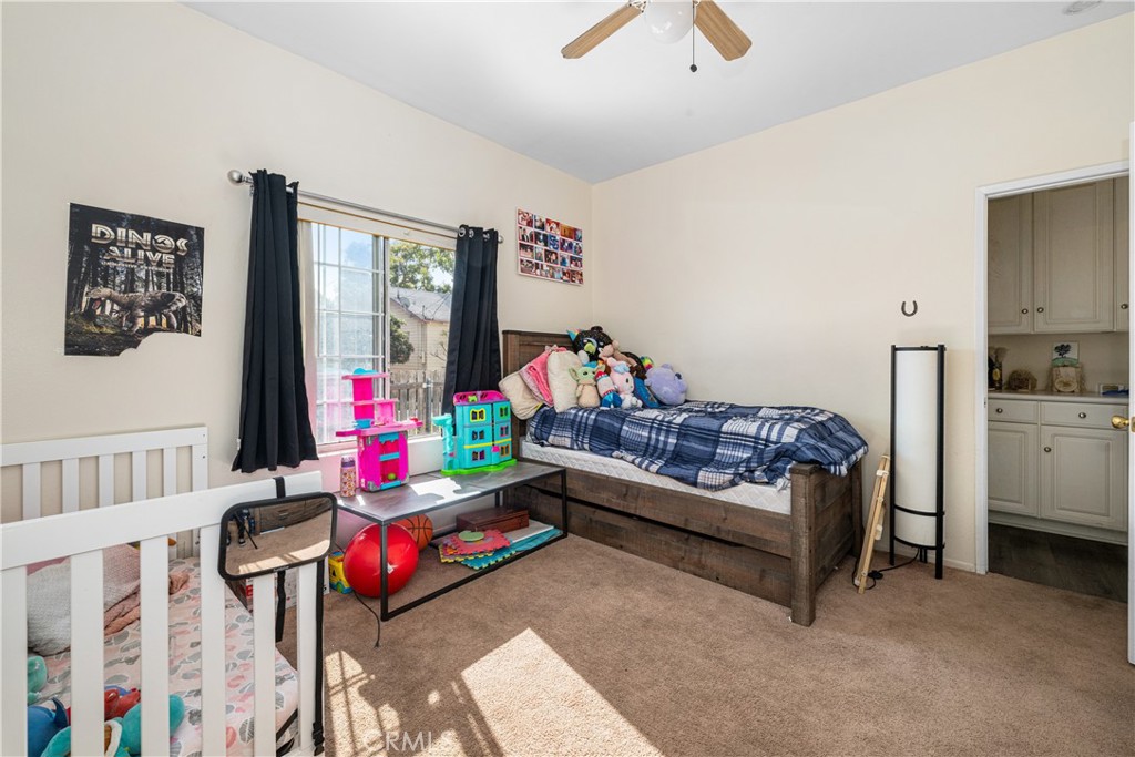 9722 Walnut Street Bellflower, CA 90706 - Photo 34 of 55 a bedroom with furniture and a couch