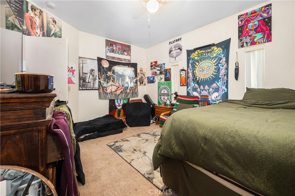 9722 Walnut Street Bellflower, CA 90706 - Photo 38 of 55 a bedroom with a bed and a flat screen tv