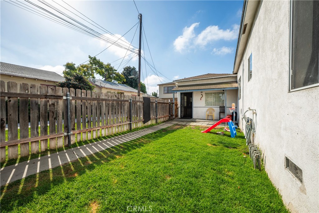 9722 Walnut Street Bellflower, CA 90706 - Photo 45 of 55 a view of a house with backyard and sitting area