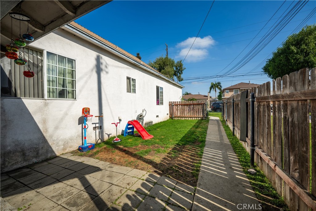 9722 Walnut Street Bellflower, CA 90706 - Photo 47 of 55 a view of a house with backyard