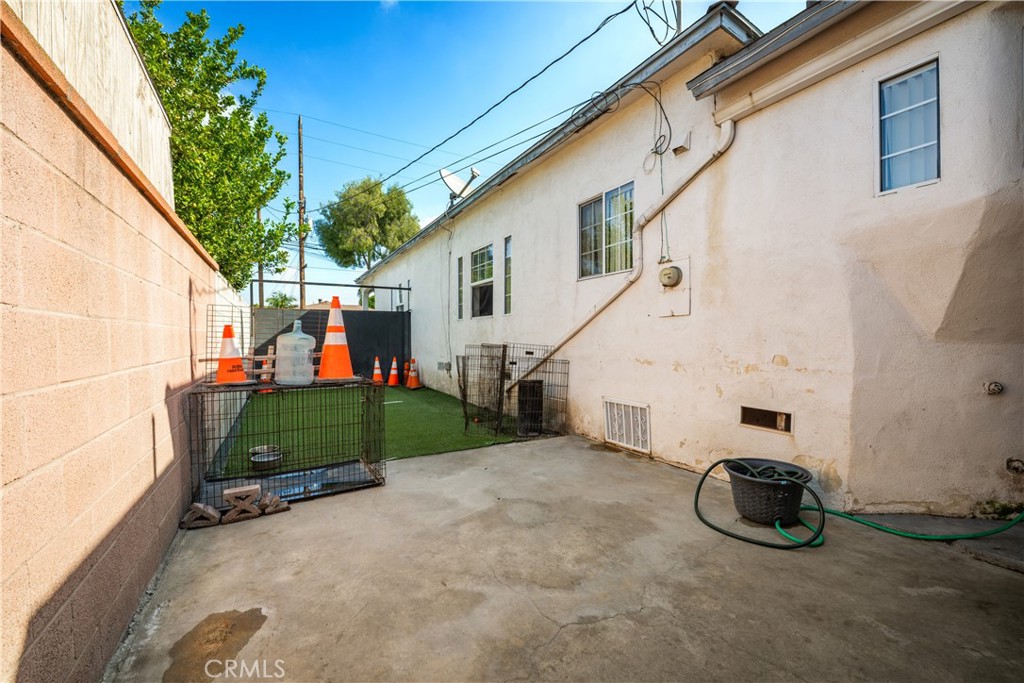 9722 Walnut Street Bellflower, CA 90706 - Photo 50 of 55 a view of a house with a back yard