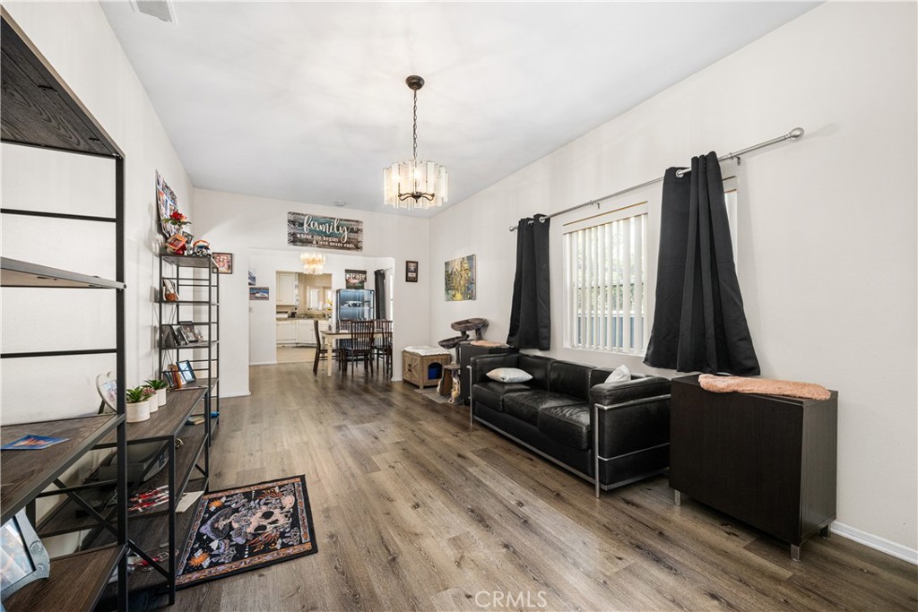 9722 Walnut Street Bellflower, CA 90706 - Photo 7 of 55 a living room with furniture and wooden floor