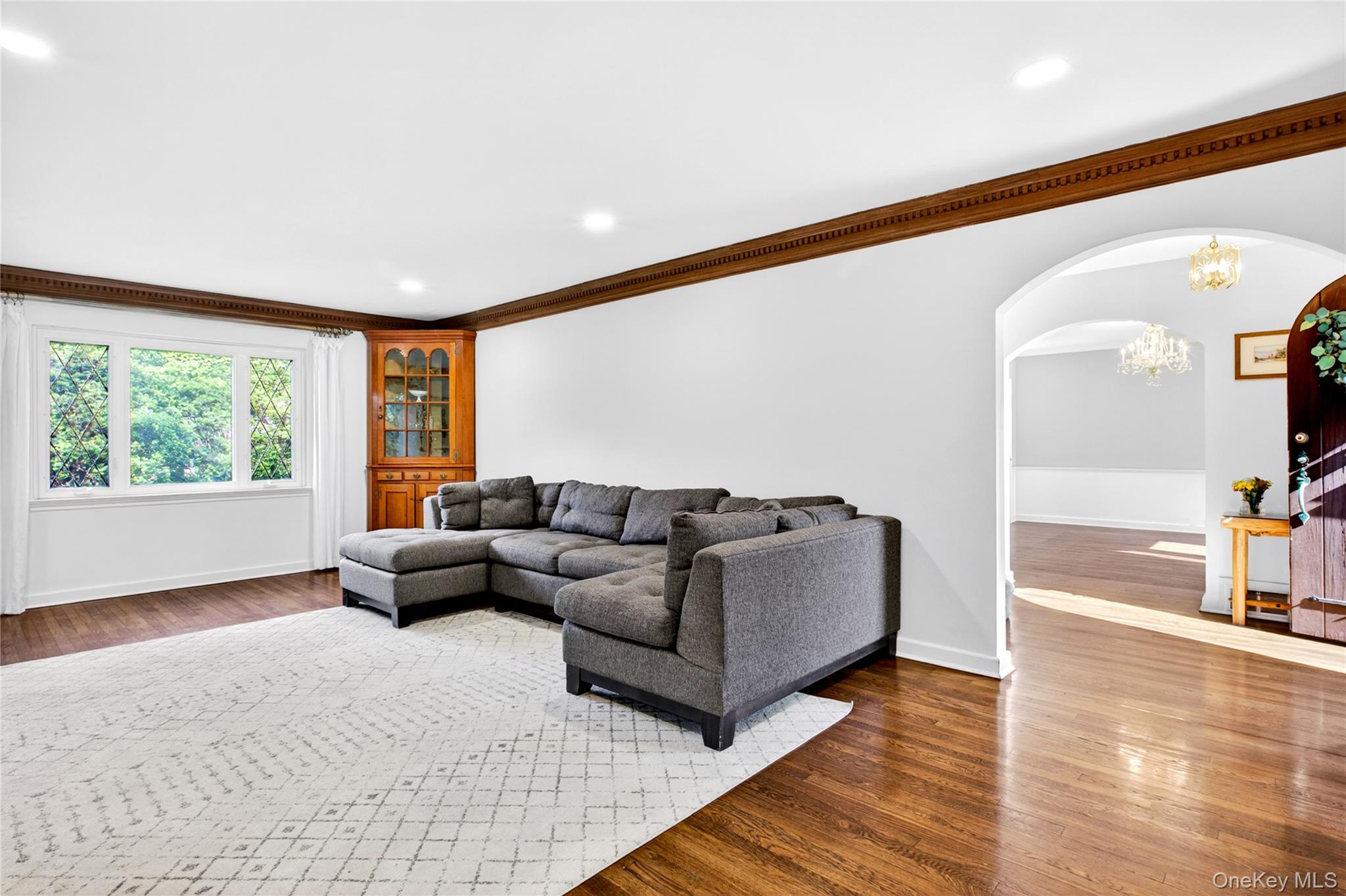 142 Mill Spring Road Manhasset, NY 11030 - Photo 4 of 23 a living room with furniture and a large window