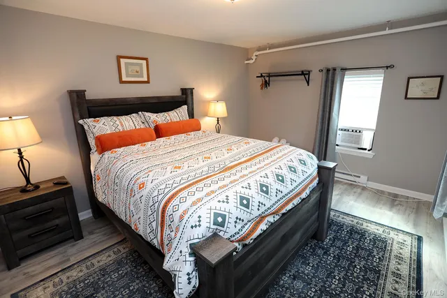 a view of a dining room with furniture and a chandelier