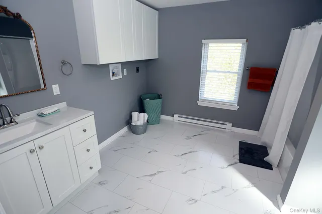 a bathroom with a shower and a toilet