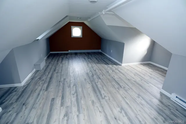a bathroom with a sink toilet and a window