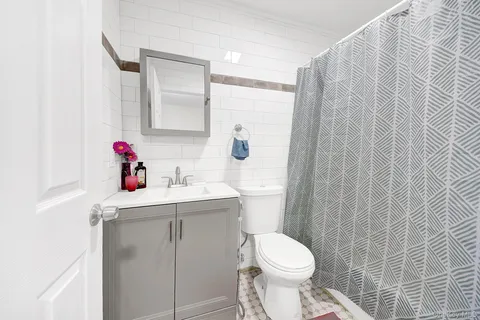 a bathroom with a sink and a stove