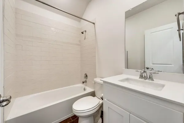 a kitchen with kitchen island a sink stainless steel appliances and cabinets