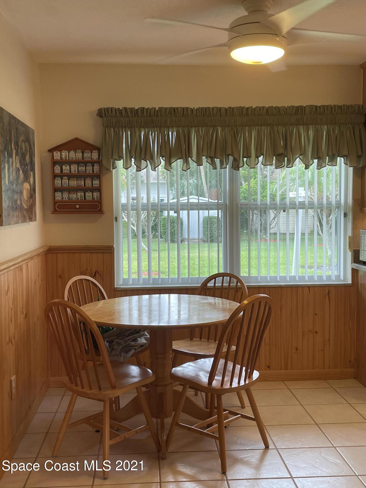 1937 Trimble Road Melbourne, FL 32934 - Photo 4 of 7 a view of a chairs and table in the balcony
