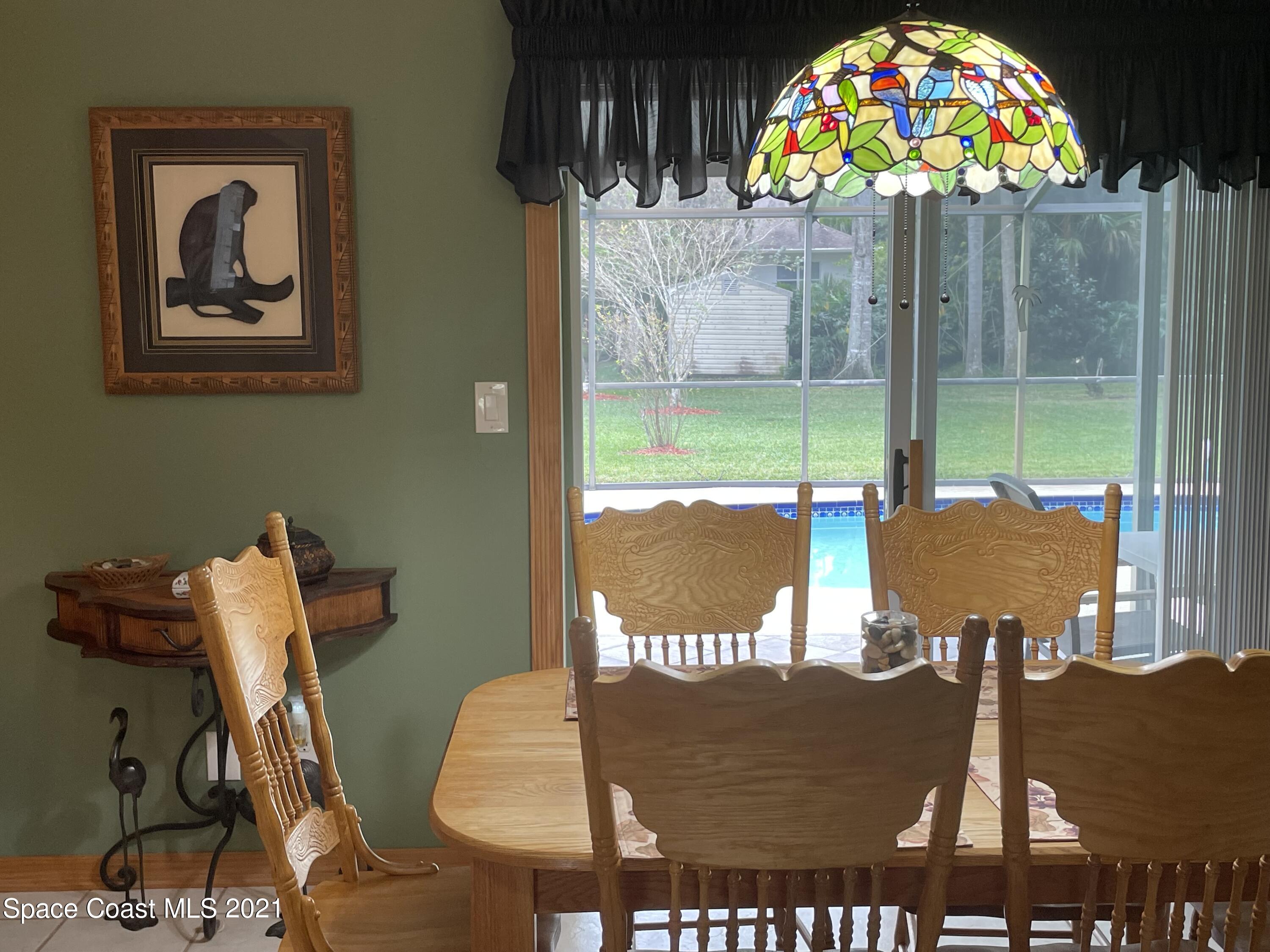 1937 Trimble Road Melbourne, FL 32934 - Photo 6 of 7 a view of a room with furniture and a flat screen tv