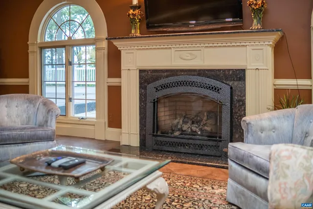 a bedroom with a large bed and a flat screen tv