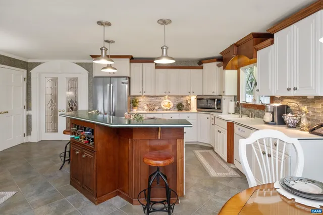 a bathroom with a sink a mirror and shower
