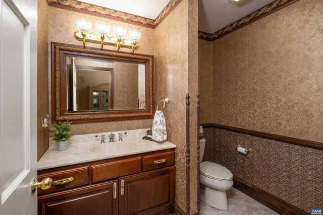a kitchen with a refrigerator sink and cabinets