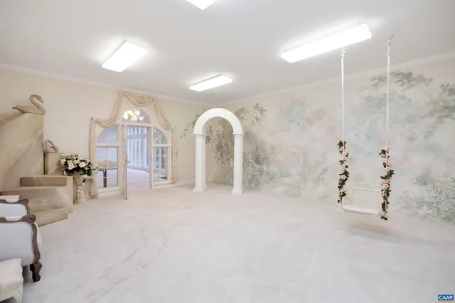 a patio with wooden floor and outdoor seating