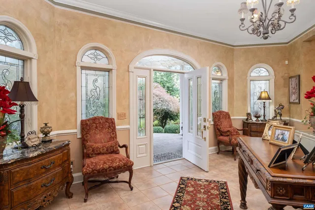a living room with furniture fireplace and rug