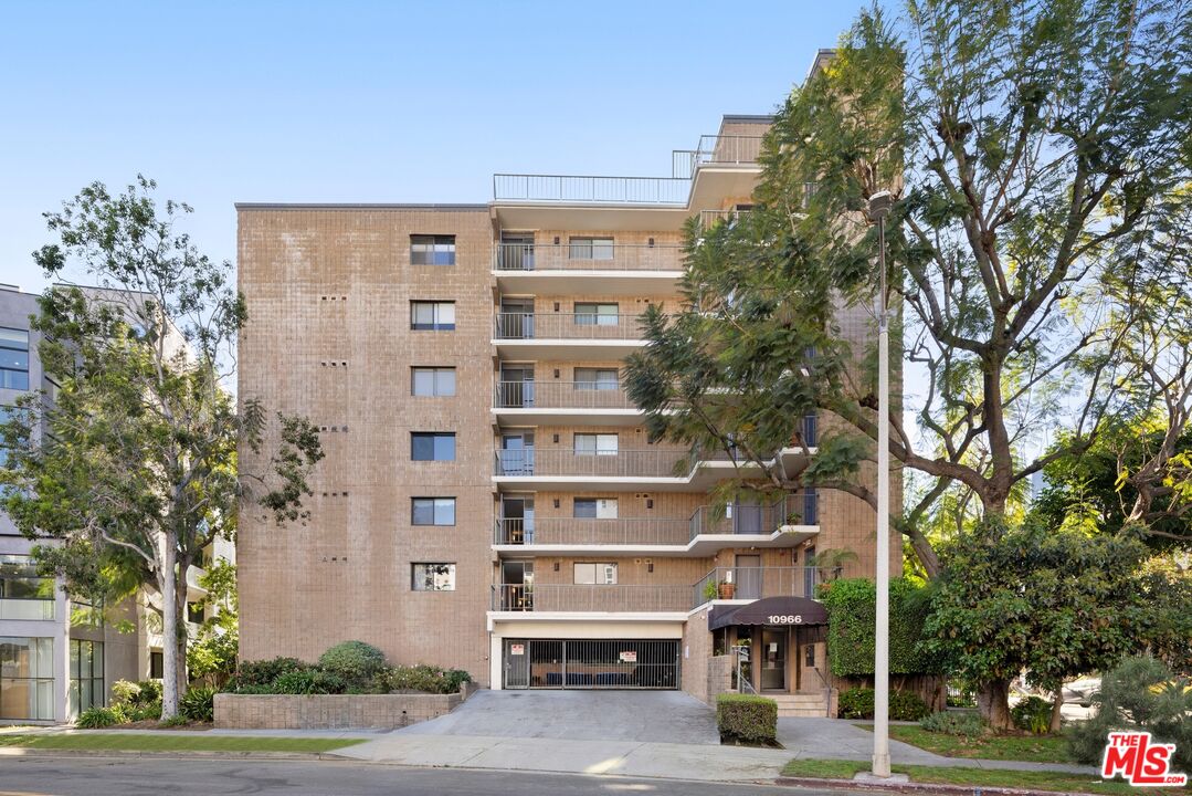 10966 Rochester Avenue, Unit 3F Los Angeles, CA 90024 - Photo 11 of 11 a front view of a building with trees