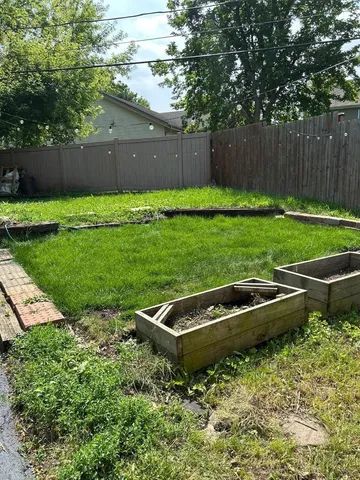 a backyard of a house with lots of green space