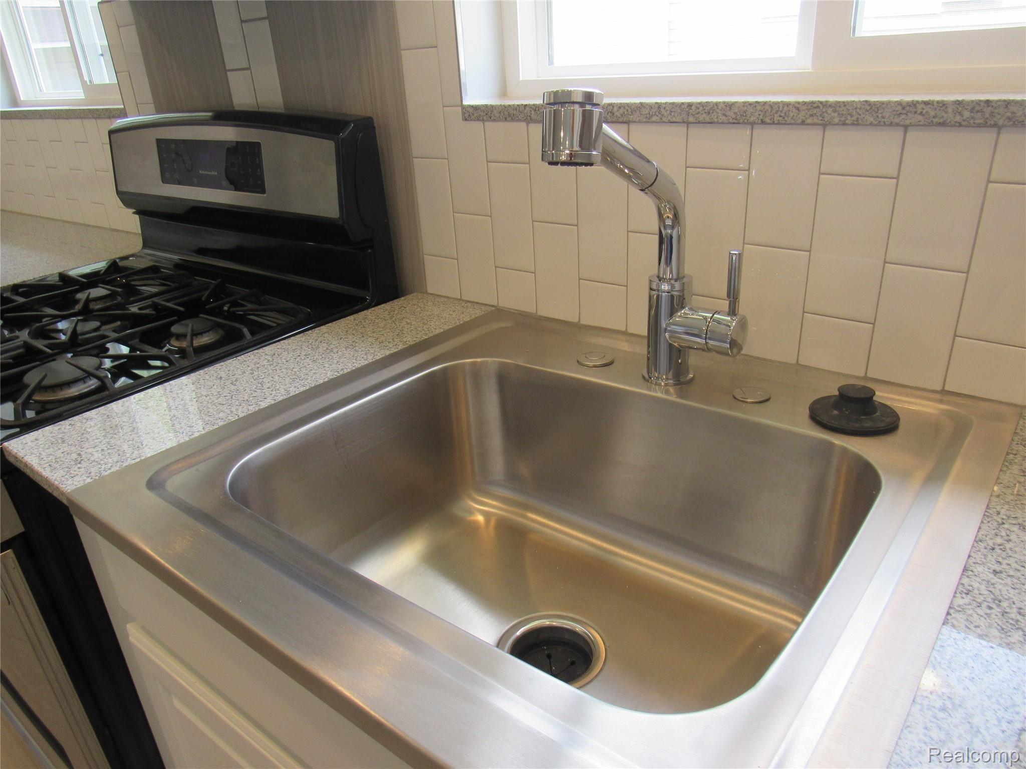 6764 Harding Street Taylor, MI 48180 - Photo 14 of 37 Goose Neck faucet with sprayer and push button disposal!